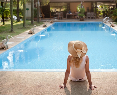 woman relaxing poolside